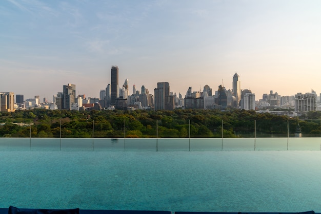 Cityscape and high-rise buildings in metropolis city with water reflection