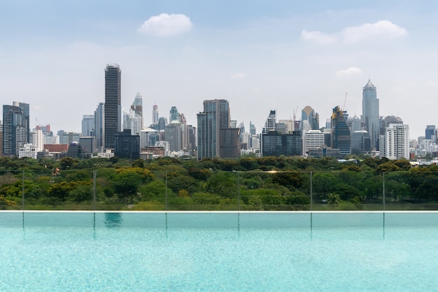 Cityscape and high-rise buildings in metropolis city with water reflection