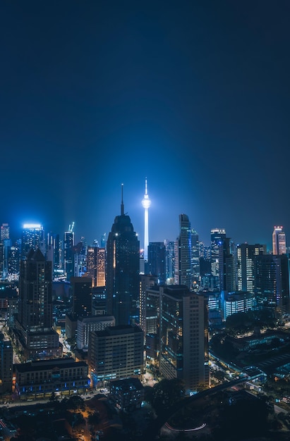 Cityscape of Kuala Lumpur city skyline at night in Malaysia.