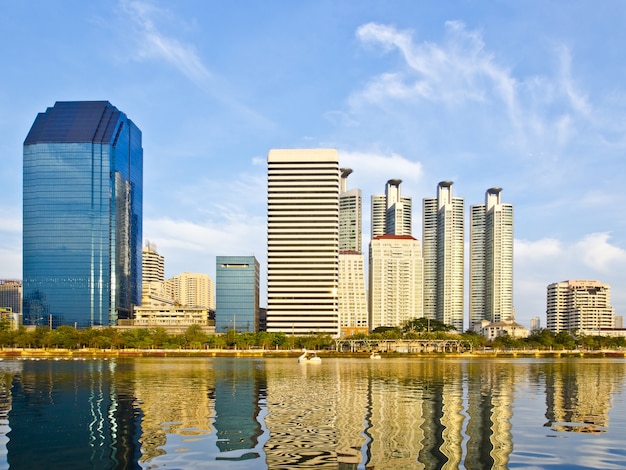 cityscape of many buildings reflection on water surface