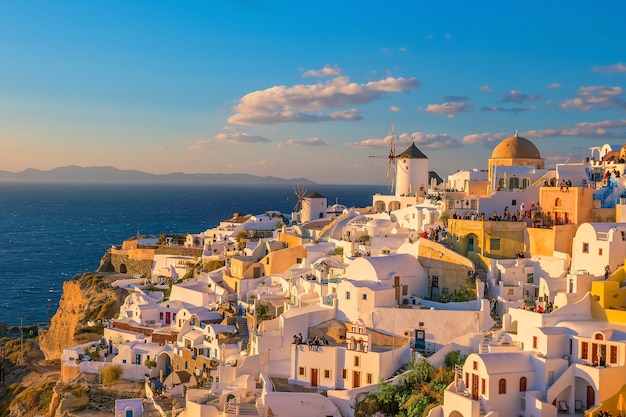 Cityscape of Oia town in Santorini island, Greece. Panoramic view at the sunset.