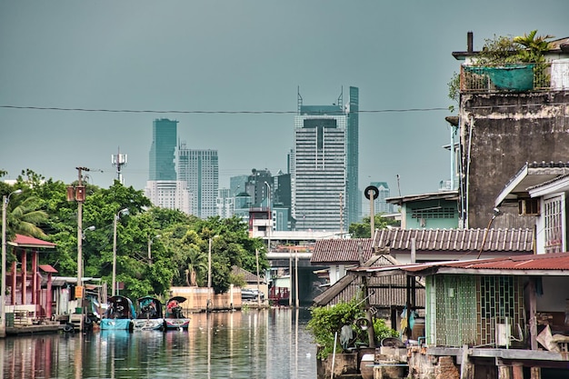 Cityscape pictures of bangkok alongside the canals next to the wat paknam temple