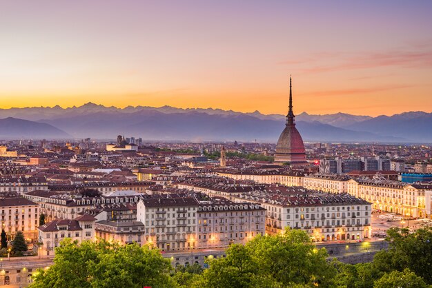 Cityscape of Torino Turin, Italy at dusk with colorful moody sky