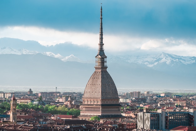 Cityscape of Torino (Turin, Italy) at sunset with storm clouds