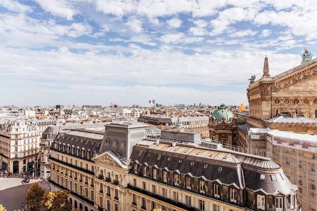 Cityscape view on the Opera house during the cloudy weather in Paris