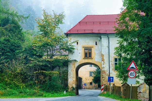 Cityscape with arch of the house at the road in Poland.