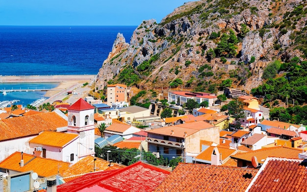 Cityscape with Buggerru city with cottage house architecture at the Mediterranean Sea in South Sardinia in Italy. Sardinian Italian small town in Sardegna.