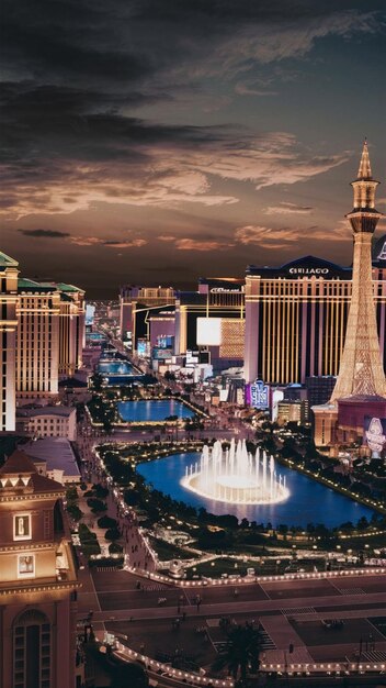 a cityscape with a fountain and a fountain in the foreground