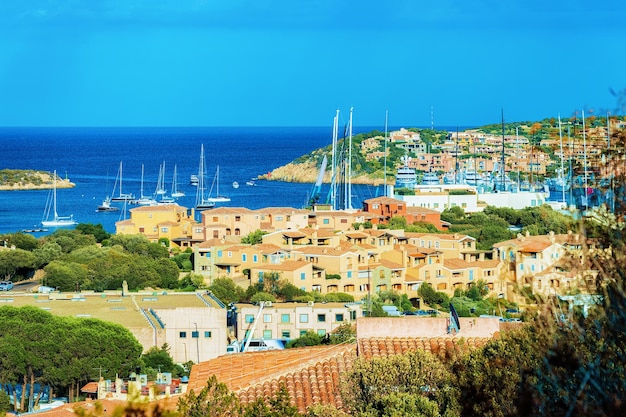 Cityscape with Luxury yachts at marina in Porto Cervo resort, Costa Smeralda Sardinia, in Italy.