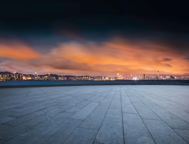 A cityscape with a sunset in the background