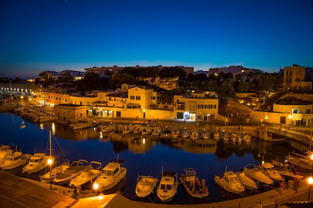 CIUTADELLA IN MENORCA, SPAIN - JUNE 30th, 2018: view of the old harbour during blue hour