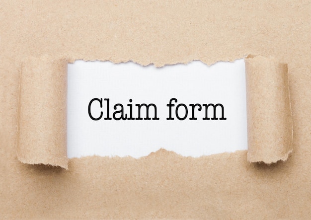 Claim Form text appearing behind torn brown paper envelope