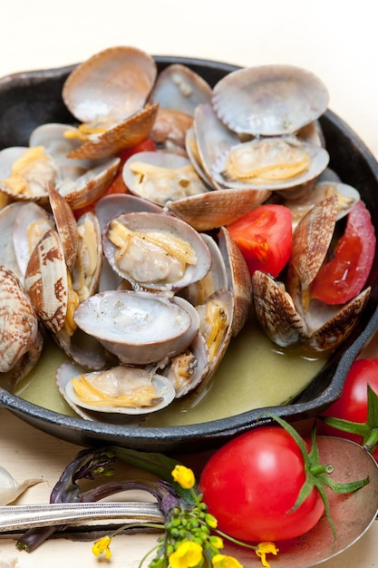 clams in cooking pan on table