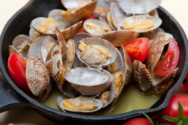 clams in cooking pan on table