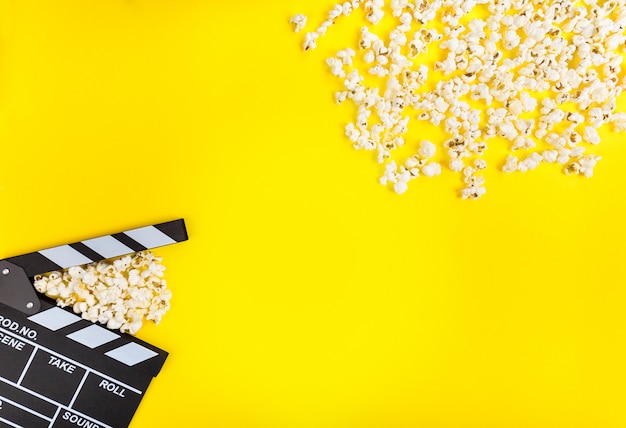 Photo clapperboard and popcorns