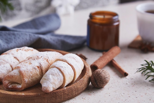 Classic aesthetic Christmas crescent handmade bagels with cinnamon sticks and walnuts Cozy home