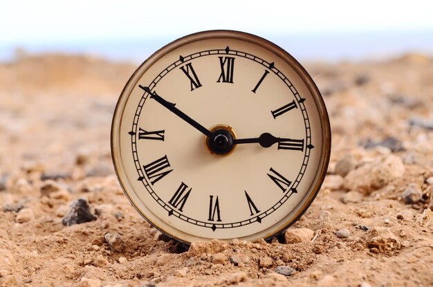 Classic Analog Clock In The Sand