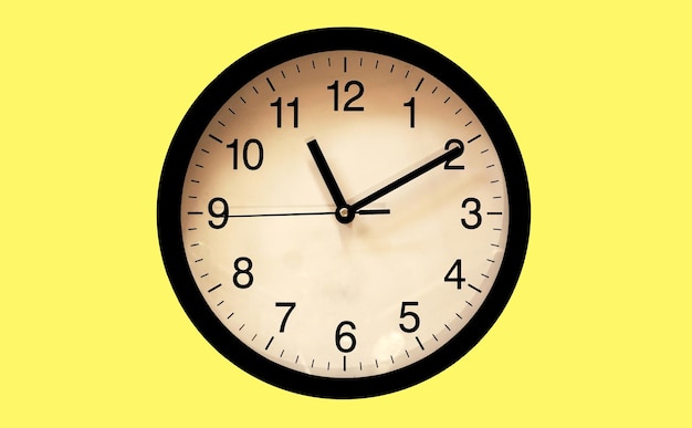 Classic black and white analog clock for background at Eleven o'clock ten minutes