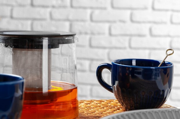 Classic blue empty ceramic tea cup on kitchen table close up