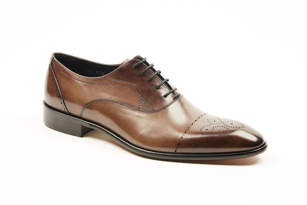 Classic brown leather mens shoe on a white isolated background.