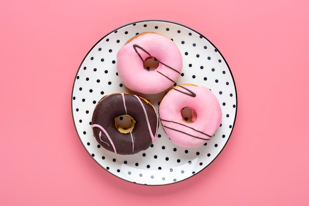 Classic chocolate strawberry donut on white round plate