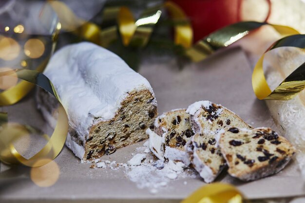 Classic Christmas stollen Christstollen seasonal yeast bread Christmas tradition with bokeh background Festive background