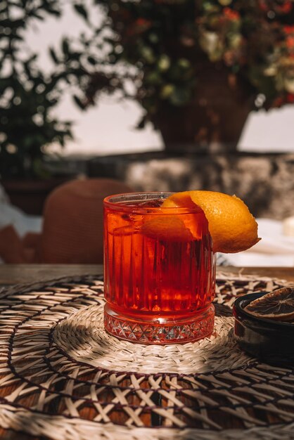 Photo classic cocktail negroni with gin, campari and martini rosso.