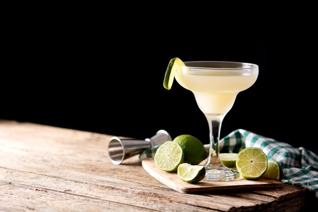 Classic daiquiri cocktail in glass on wooden table