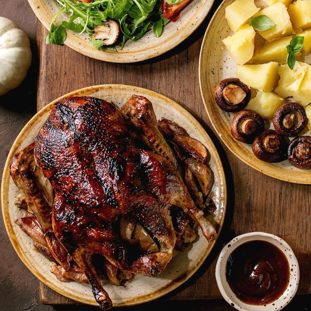 Classic dish roasted glazed duck with apples and garnish