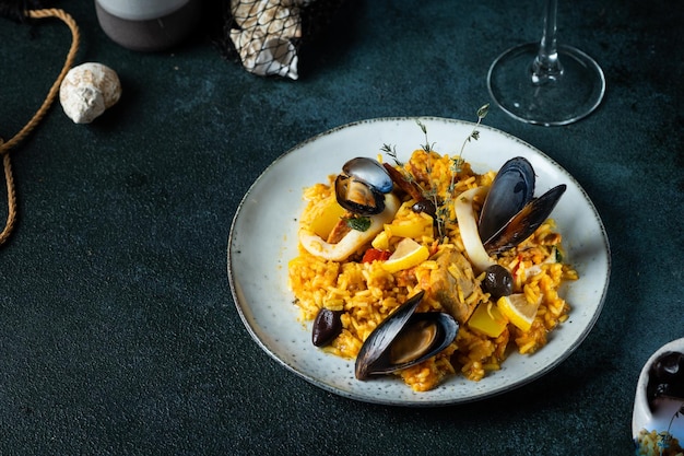 Classic dish of Spain seafood paella Spanish paella with shrimps clamps mussels mediterranean cuisine