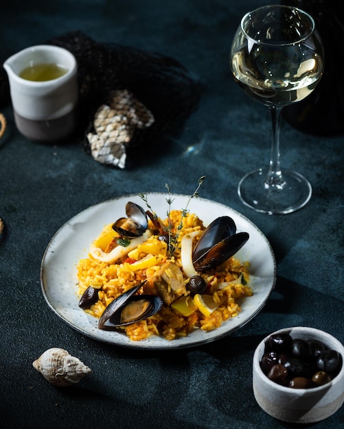 Classic dish of Spain seafood paella Spanish paella with shrimps clamps mussels mediterranean cuisine