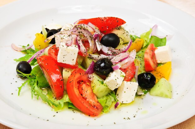 Classic greek salad on a dish in restaurant