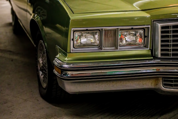 Classic green car close up.