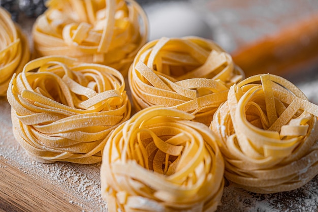 Classic italian fettuccine pasta made at home according to traditional italian recipes