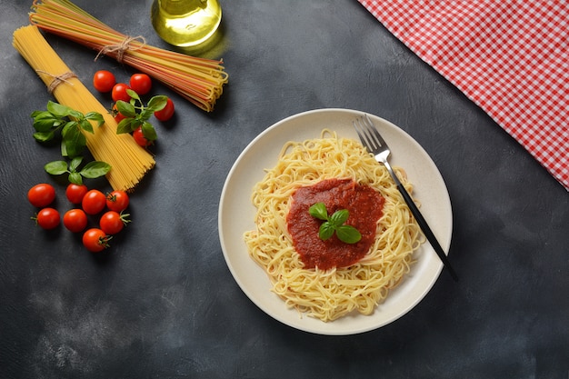 Classic Italian spaghetti pasta with tomato sauce and basil