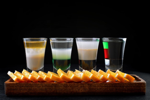 Classic layered cocktails on a wooden board