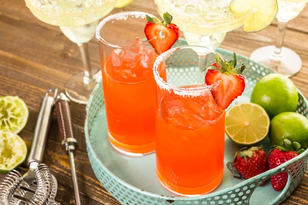 Classic lime and strawberry margaritas on the rocks.