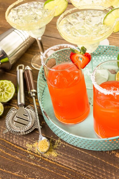 Classic lime and strawberry margaritas on the rocks.