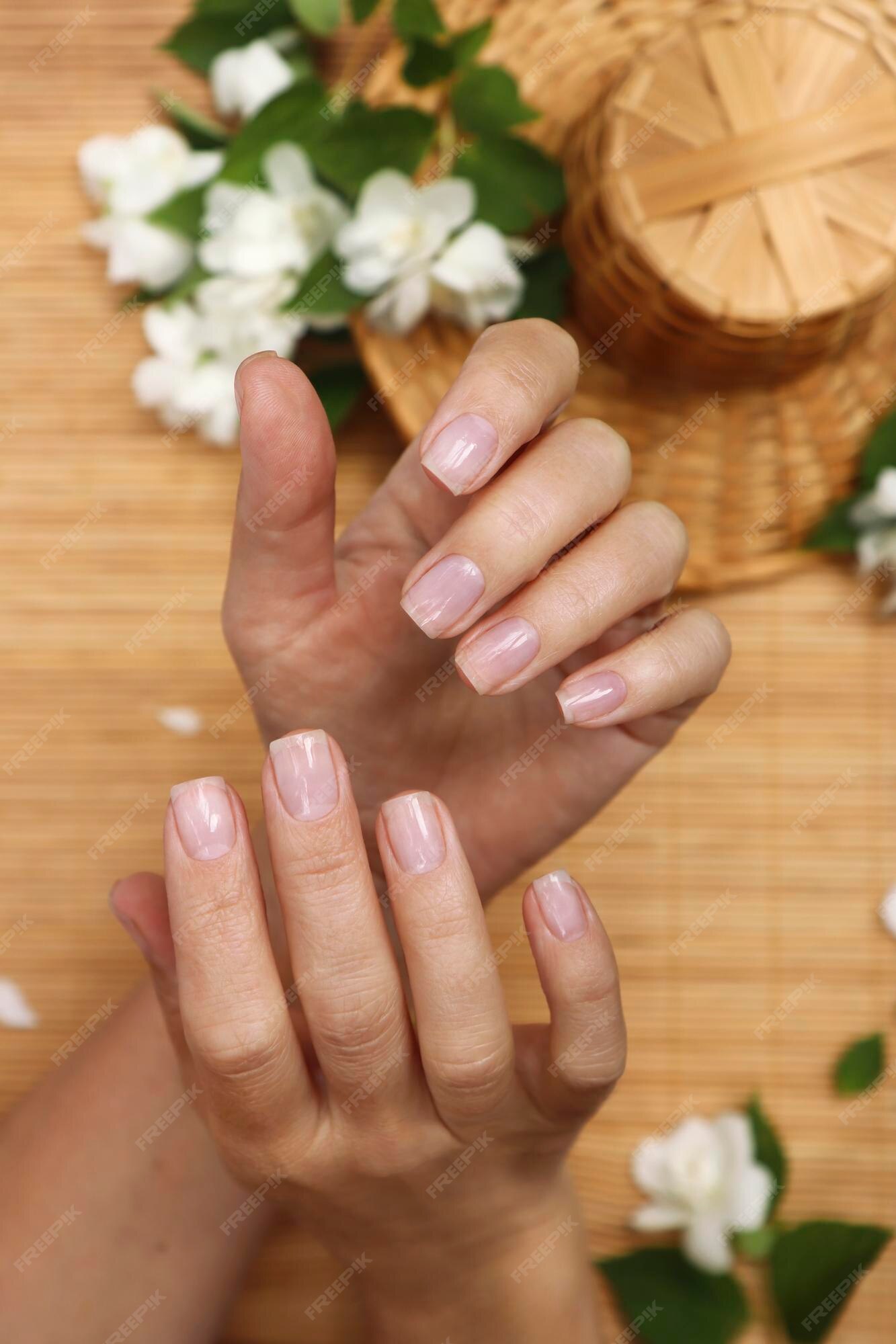 Premium Photo | Classic manicure with a shiny top coat for nails. Premium Photo | Classic manicure with a shiny top coat for nails.