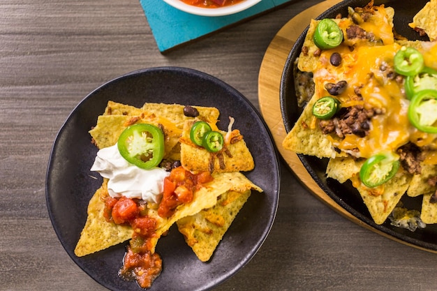 Classic nachos with ground beef and fresh jalapeno chili peppers.