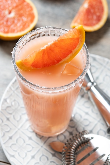 Classic paloma cocktail on wooden table