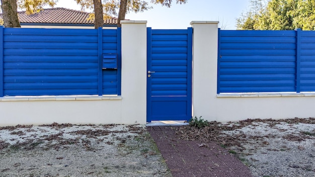 Classic pedestrian blue door metal home gate at entrance of house portal garden Aluminum