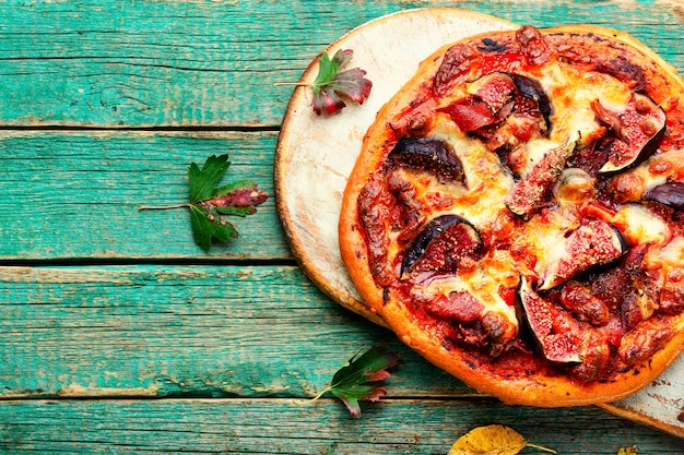 Classic pizza with bacon and fruitspace for text