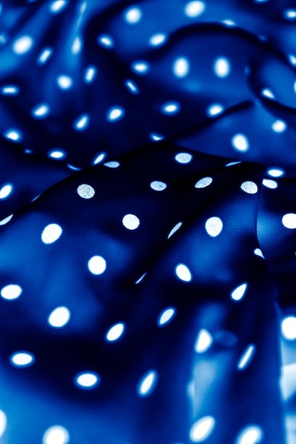 Classic polka dot textile background texture white dots on blue luxury fabric design pattern