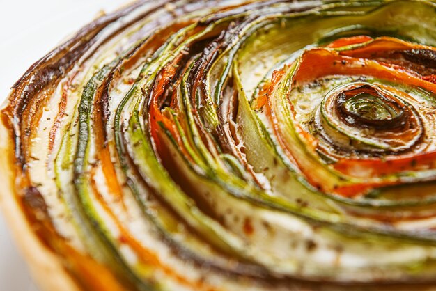 Classic ratatouille pie on a light gray table.