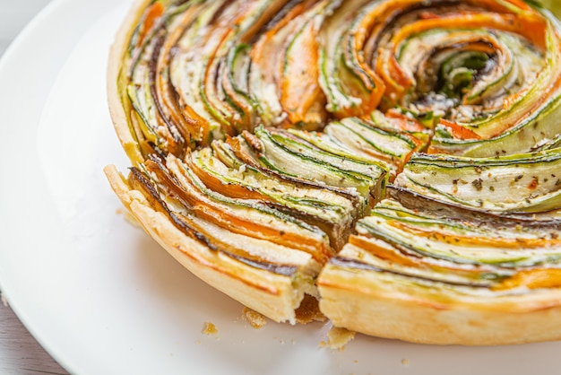Classic ratatouille pie on a light gray table.