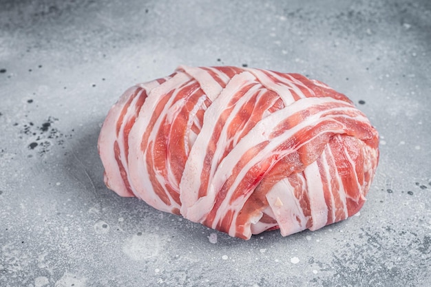 Classic raw meatloaf with ground beef meat and bacon uncooked meat loaf Gray background Top view