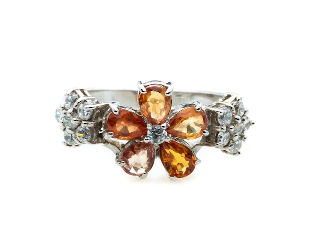 classic ring with a yellow/orange topaz stone on white background