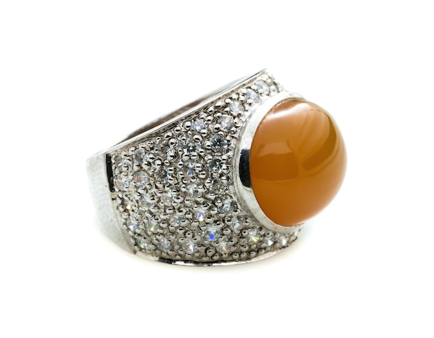 classic ring with a yellow topaz stone on white background