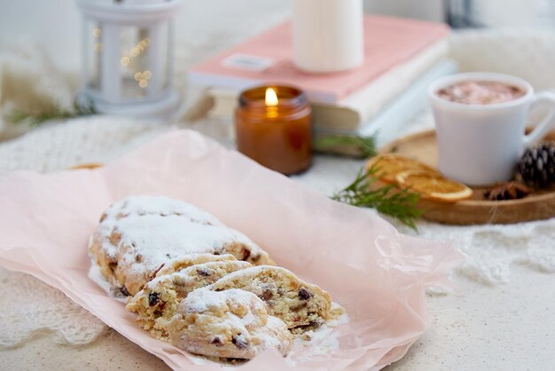 Classic seasonal Christmas bread traditional stollen cup of cocoa and candle Holiday Season Festive romantic breakfast